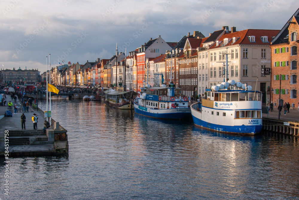 Colorful houses along the canal in Nyhavn harbor in the historical city center of Copenhagen, Denmark