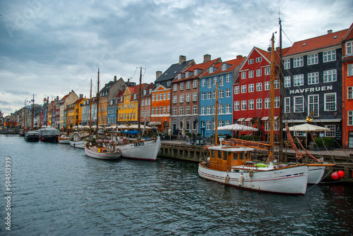 Colorful houses along the canal in Nyhavn harbor in the historical city center of Copenhagen, Denmark