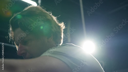 Caucasian man panting after intense exercise in the gym. Slow motion photo