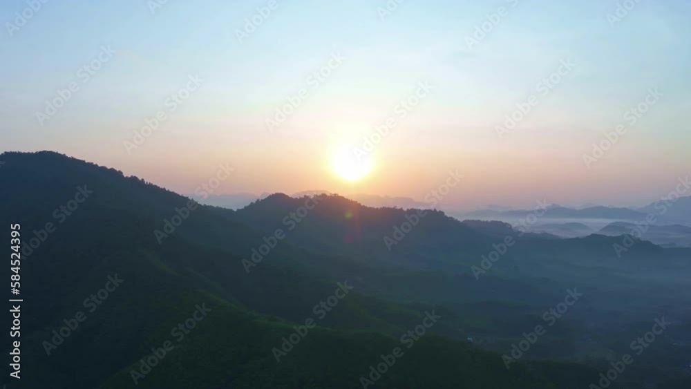 Aerial view of Sunrise sky with mountains at morning sunrise in Thailand,Amazing Landscape of nature light sky dramatic clouds at magic moment,Fantastic natural drone timelapse over mountains Aerial view of Sunrise sky with mountains at morning sunrise in Thailand,Amazing Landscape of nature light sky dramatic clouds at magic moment,Fantastic natural drone timelapse over mountains