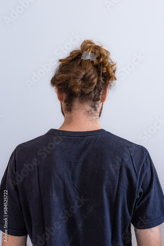 Blond long hair white man wearing black t shirt on white background