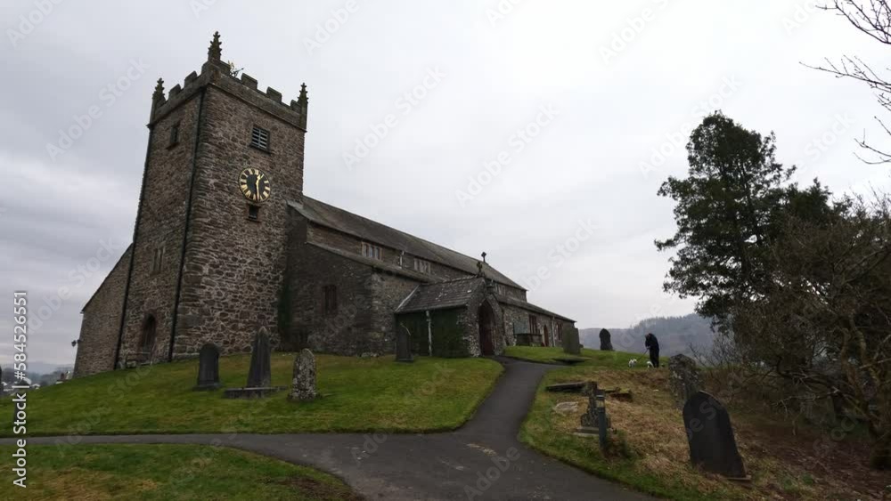 St Michael and All Angels Church in Hawkshead, showing fields and grazing sheep Cumbria, UK St Michael and All Angels Church in Hawkshead, showing fields and grazing sheep Cumbria, UK