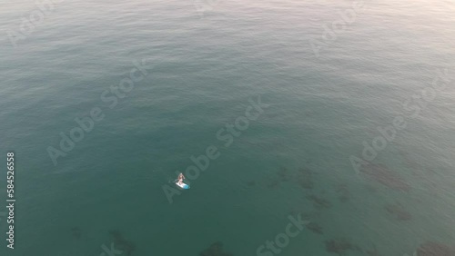 Aerial view with drone over a southern Spanish beach in Marbella, Andalusia, Spain, calm waves on crystal clear water. photo