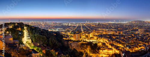 Panorama of Barcelona in Spain before sunrise photo
