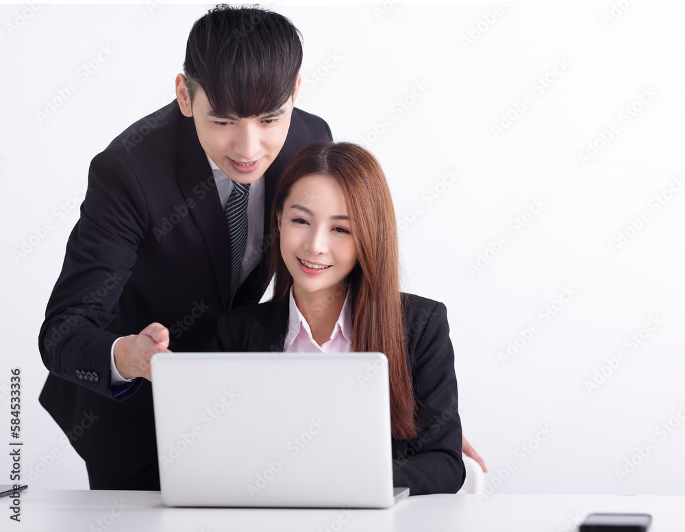 Business team using laptop and working together in office Business team using laptop and working together in office