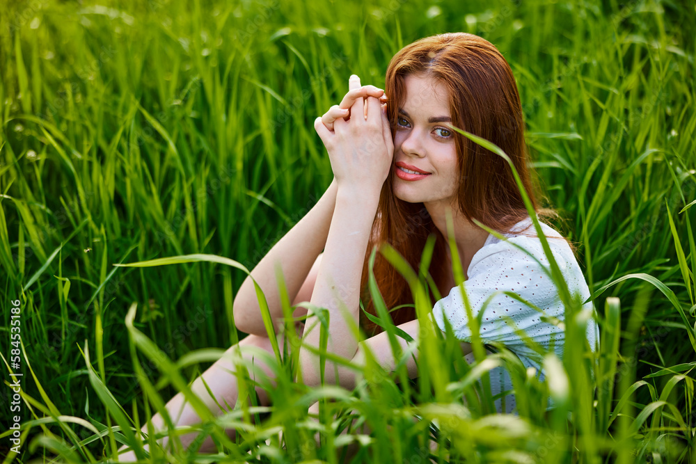 cute woman in summer high grass sits in a light dress cute woman in summer high grass sits in a light dress