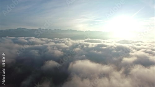 Wallpaper Mural Ascending above cloudscape to see sunrise and mountain range Torontodigital.ca