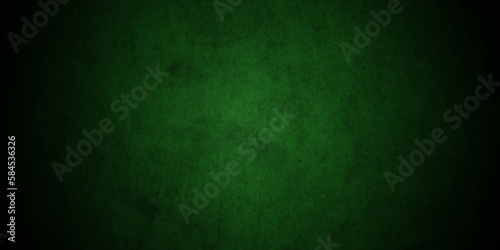 Dark green grunge background texture with black vignette in old vintage textured backdrop border design. Dark green Stucco Texture Background. 