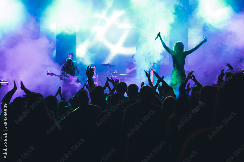 Obraz premium Crowd at concert and blurred stage lights.