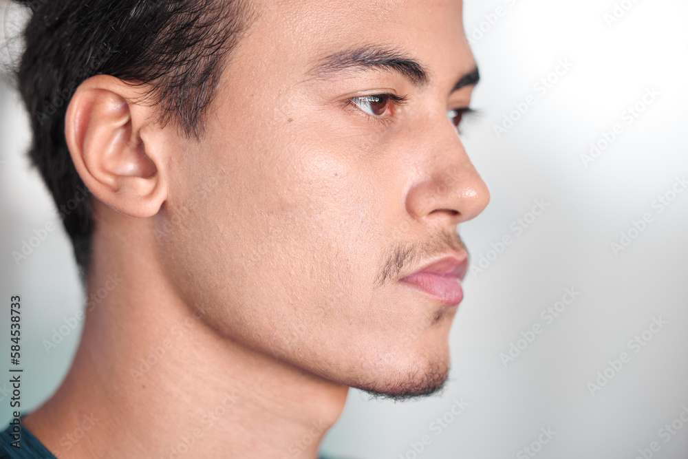 Obraz premium Face, thinking and focus with a sports man in a gym, looking serious during his workout for health. Idea, serious and mindset with a handsome young male athlete training in a lifestyle center