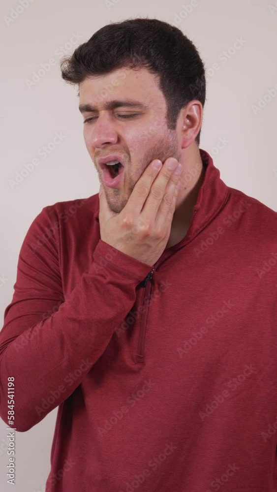 Vertical video of a white man with a toothache, expression of anguish and discomfort. Vertical video of a white man with a toothache, expression of anguish and discomfort.