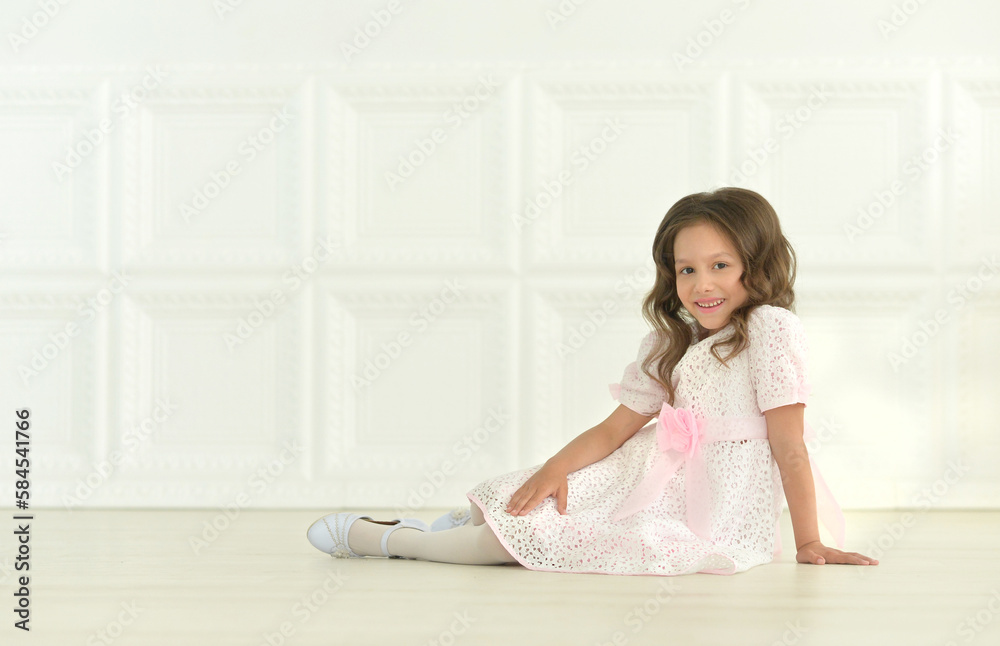 Portrait of girl posing on the floor in studio Portrait of girl posing on the floor in studio