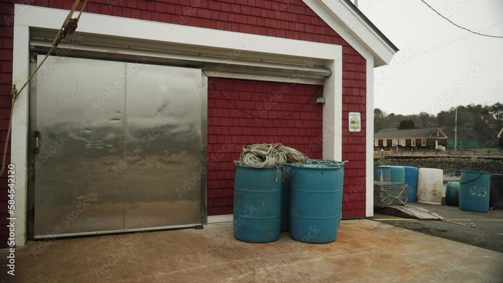 Lobster fishing shack on pier with metal freezer door, 4K. marine resources. Lobster fishing shack on pier with metal freezer door, 4K. marine resources.