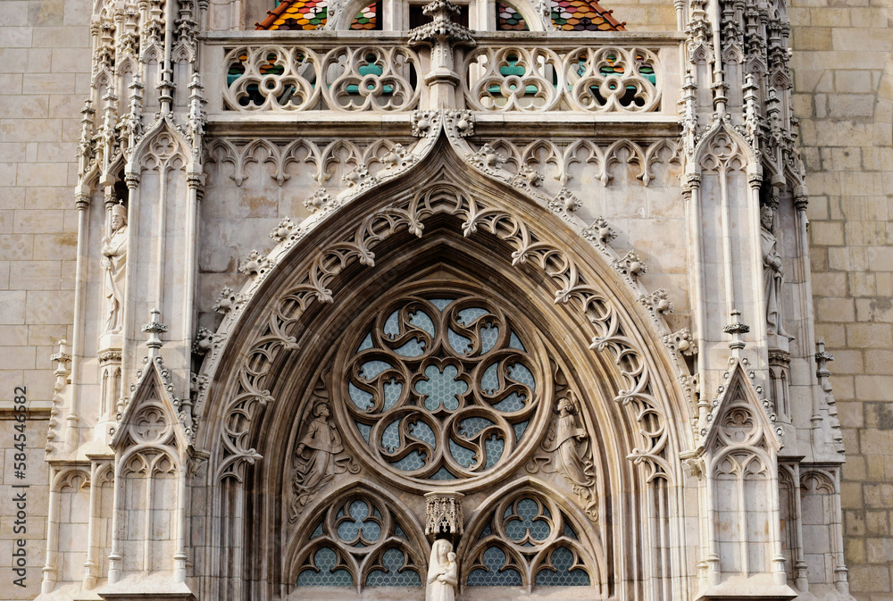 richly decorated stone elevation detail of gothic cathedral in Budapest. the Matthias church in the castle district. famous landmark. carved sculptures and decorative elements. travel and tourism..