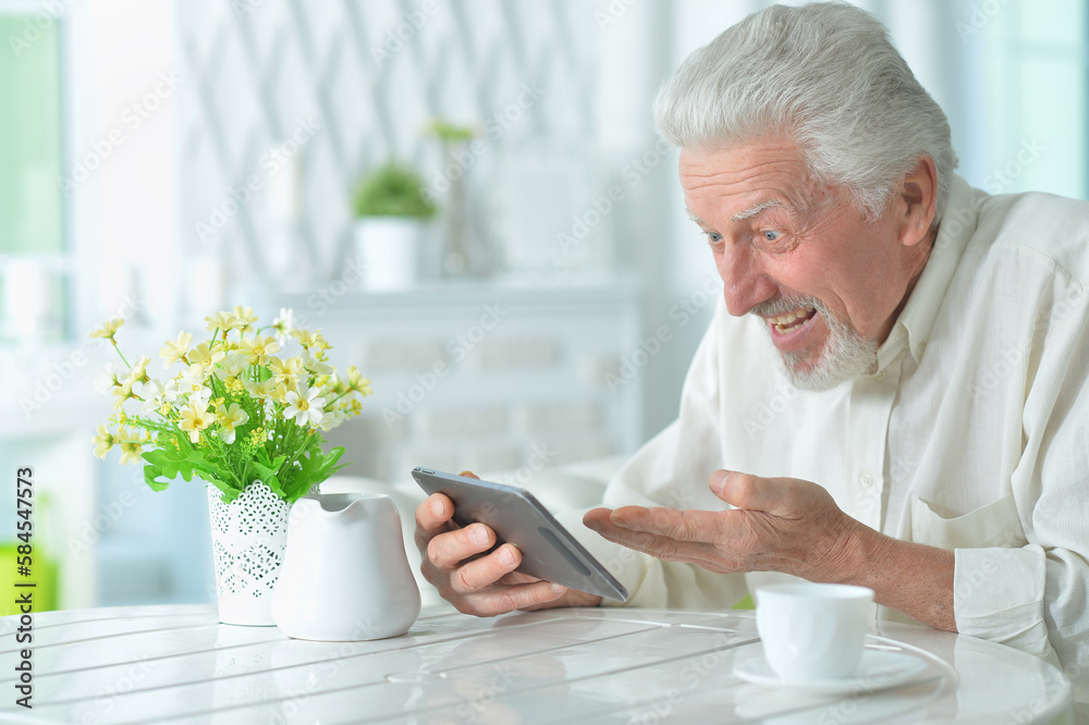 Portrait of senior man using tablet Portrait of senior man using tablet