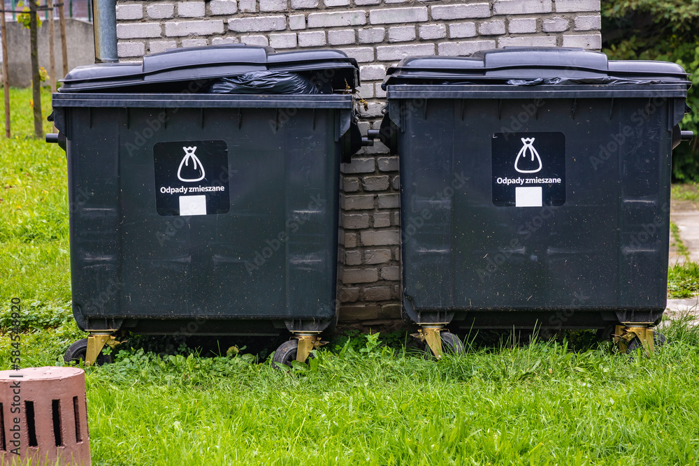 Dumpsters with icons of mixed waste in Warsaw city, Bulgaria Dumpsters with icons of mixed waste in Warsaw city, Bulgaria