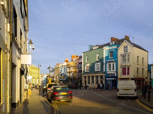 Street in seaside town at late afternoon (Tenby, Wales, United Kingdom, in summer)