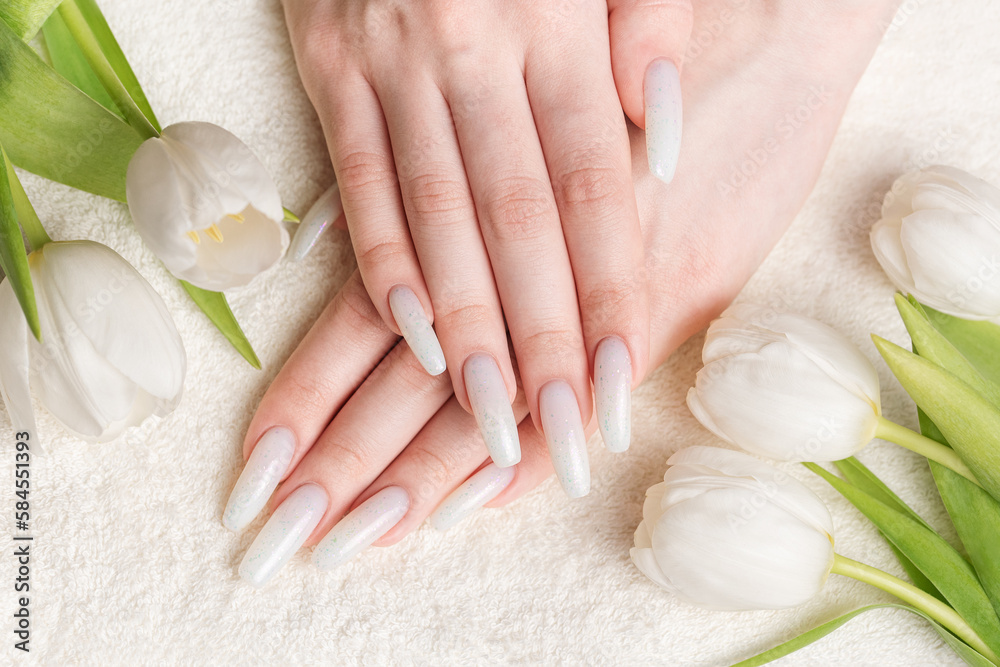 Female hand with spring nail design.