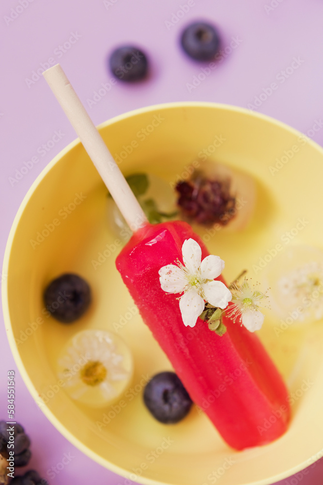 Colorful popsicles in bowls close up Colorful popsicles in bowls close up