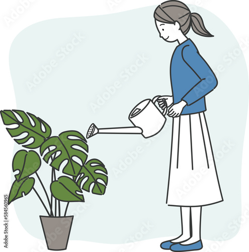 観葉植物の手入れをする女性