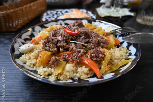 Lunch in ethnic, national, Uzbek style. Uzbek lunch with pilaf.