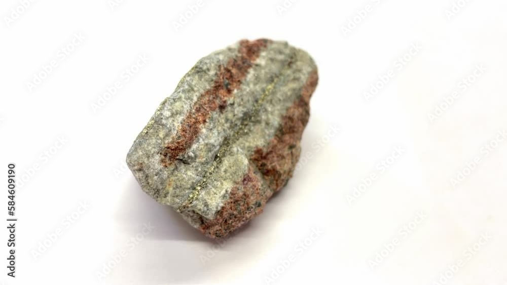 Ore Chalcopyrite on white background, is a copper iron sulfide mineral that crystallizes in the tetragonal system