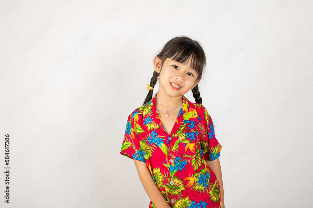 Happy Songkran Day, Asian kid girl with floral shirt hold water gun, Thai child funny hold toy water pistol and smile, isolated on white background, Thailand Songkran festival national culture concept Happy Songkran Day, Asian kid girl with floral shirt hold water gun, Thai child funny hold toy water pistol and smile, isolated on white background, Thailand Songkran festival national culture concept