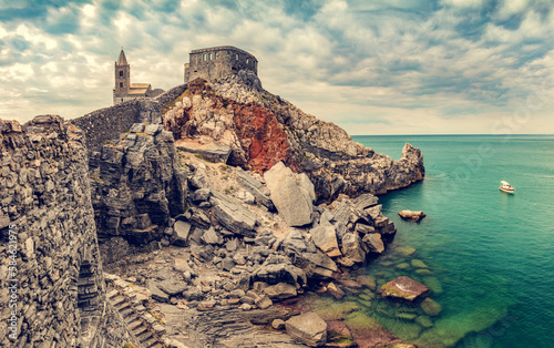 Porto Venere, Italy with church of St. Peter on cliff. photo