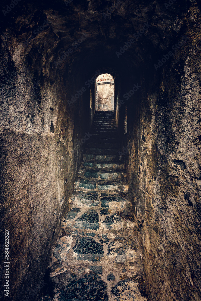Ancient stairs in dungeon tunnel in Doria Castle in Porto Venere, Italy Ancient stairs in dungeon tunnel in Doria Castle in Porto Venere, Italy