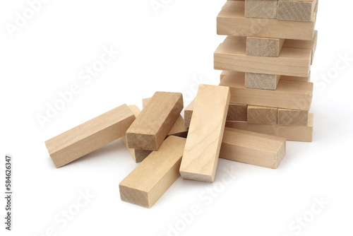 A game of wooden bricks in a half-destroyed state be on a white background.