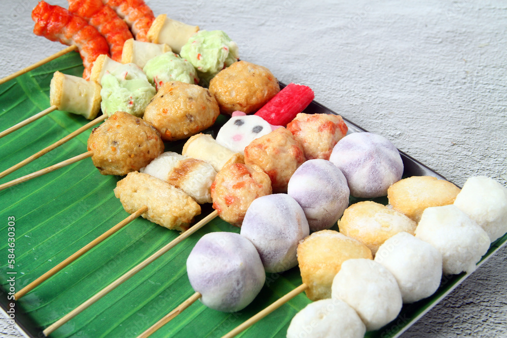 Freshly cooked assorted Filipino street food called Fish balls, squid