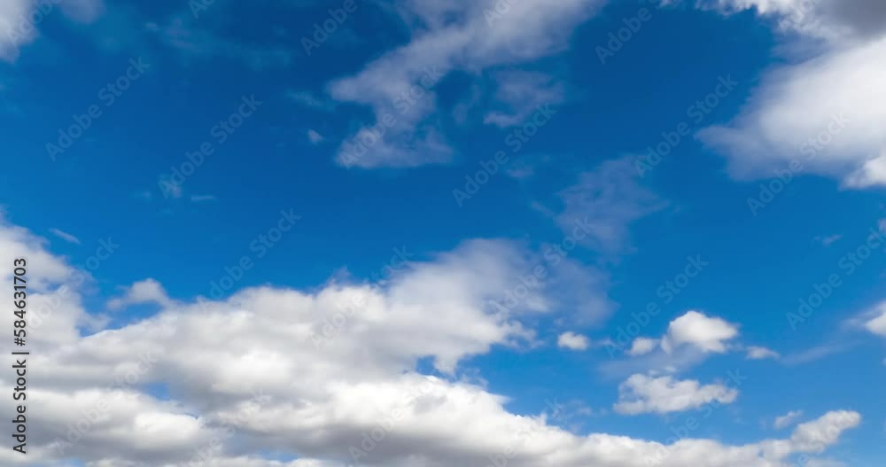 White thick clouds flying quickly by the skies. Rainy clouds formation in the atmosphere. Low angle view. Timelapse. White thick clouds flying quickly by the skies. Rainy clouds formation in the atmosphere. Low angle view. Timelapse.