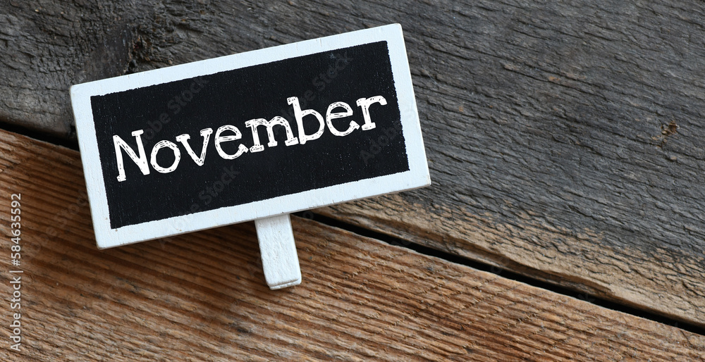 Naklejka premium November on chalk board and table.