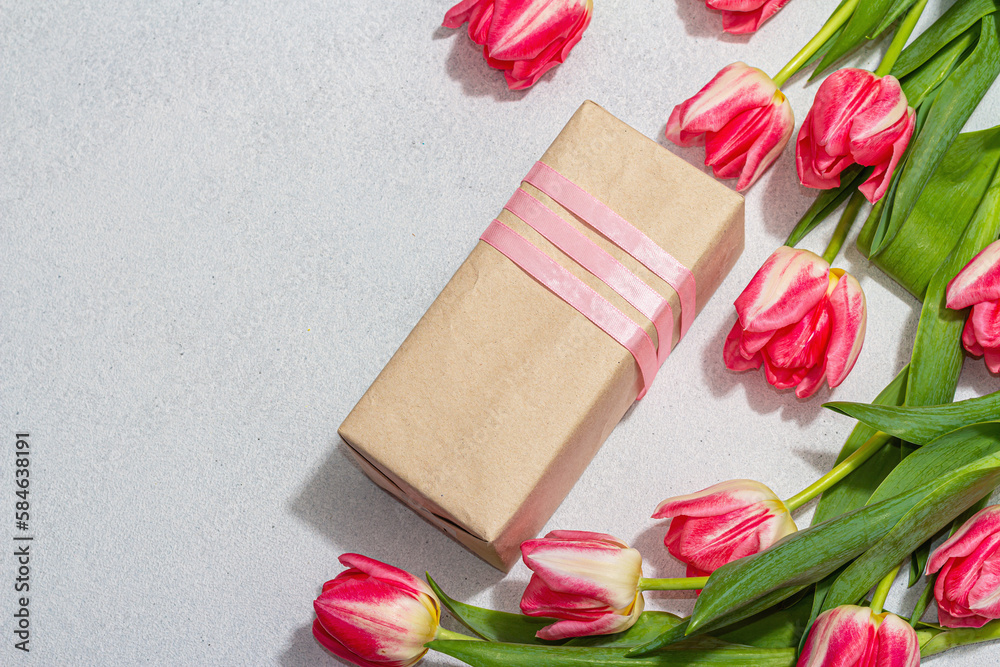 Zero waste spring gift concept. Pink tulips, surprise box for Anniversary, Mothers or Valentines Day Zero waste spring gift concept. Pink tulips, surprise box for Anniversary, Mothers or Valentines Day