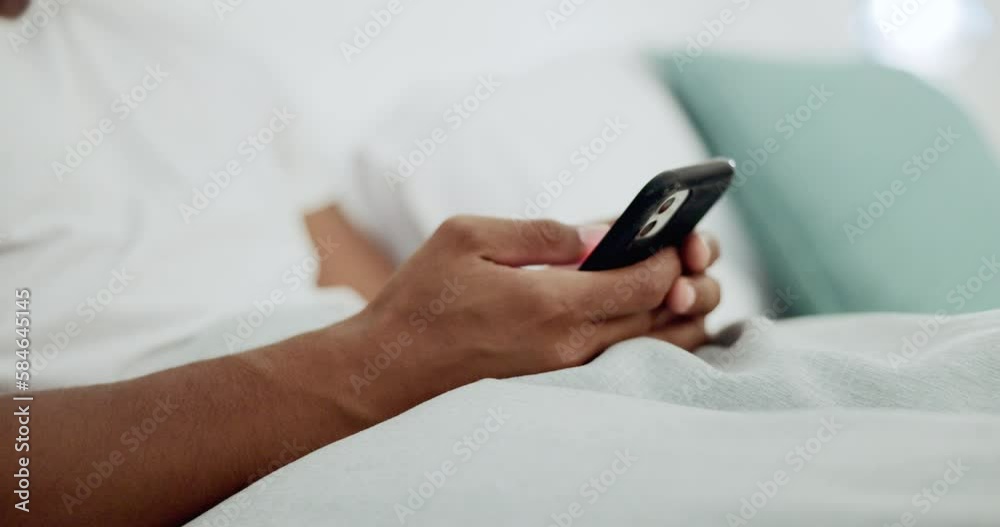 Scrolling, bed and hands of a man with a phone for social media, communication and chat. Contact, internet and guy on a mobile app for messages, reading emails or notification in the bedroom Scrolling, bed and hands of a man with a phone for social media, communication and chat. Contact, internet and guy on a mobile app for messages, reading emails or notification in the bedroom