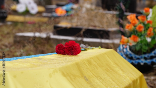 Ukraine. War. The funeral ceremony of a soldier. Funeral ceremony. The funeral of Ukrainian soldiers who died during the Russian invasion of Ukraine. Coffin decorated with flowers