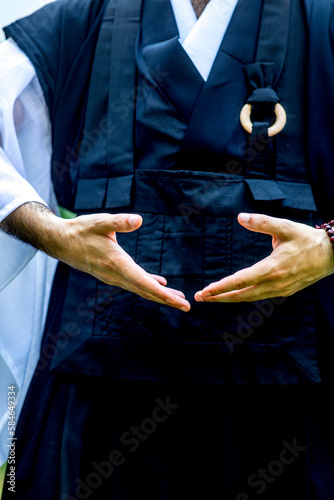 Zen sesshin (retreat) in Paris, France. Retreatant practising qi gong. photo