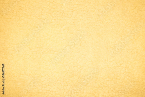 Yellow sheep fur with a texture of fibers. Pattern soft canvas for various purposes