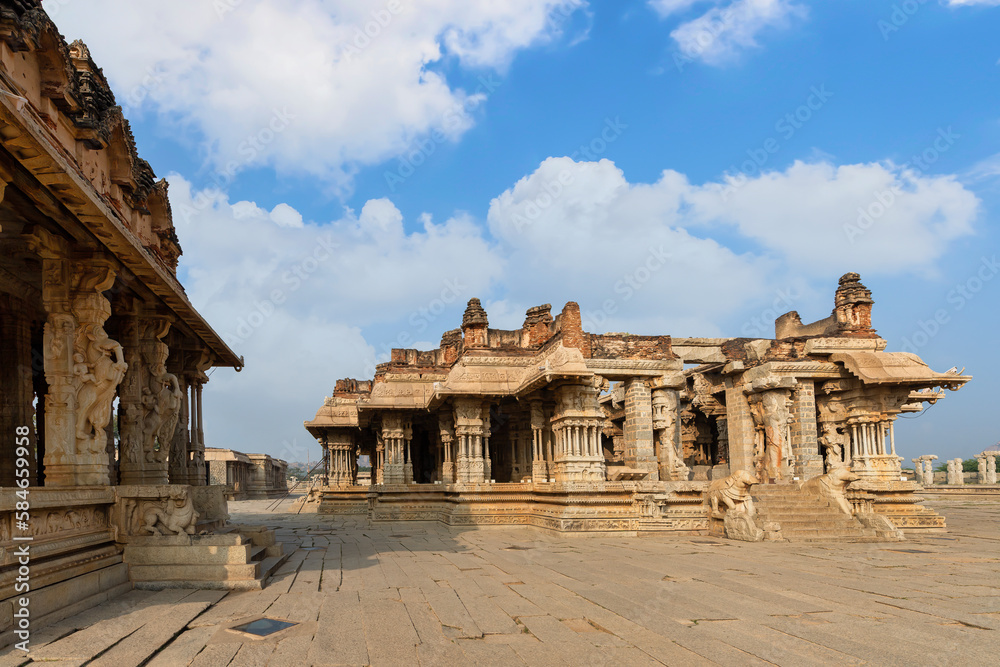 Ancient sandstone medieval architecture with intricate carvings at Hampi Karnataka, India