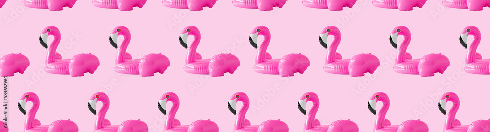 Fototapeta premium Seamless pattern for textiles and wrapping paper. Pink background, pink inflatable flamingo beach circles, the concept of summer time, beach holidays. 3d render illustration.