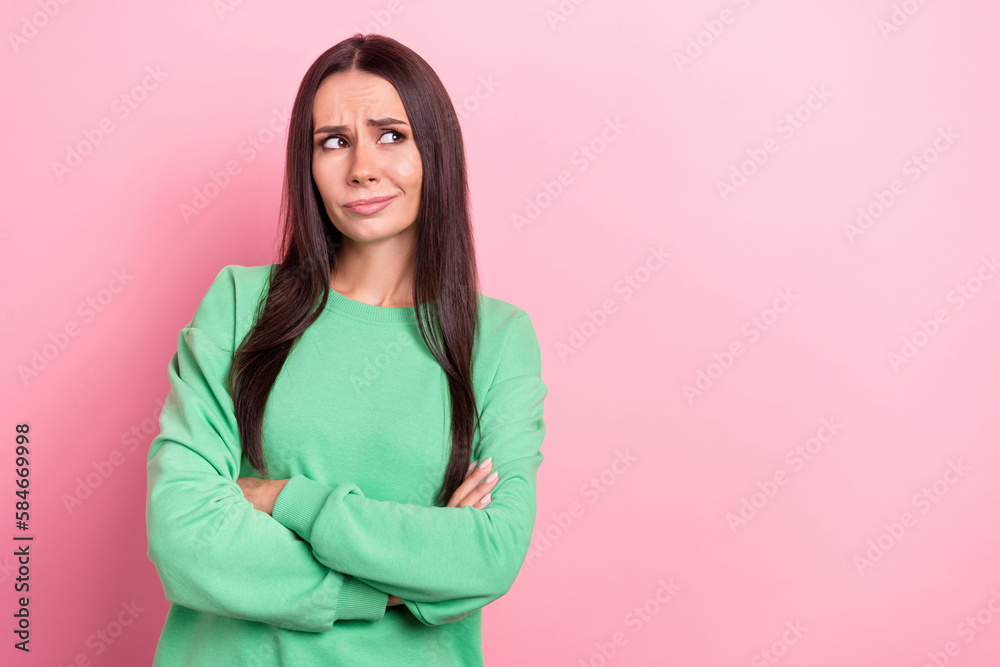 Photo of young minded intelligent ponder thoughtful woman wearing green pullover folded hands look mockup isolated on pink color background - obrazy, fototapety, plakaty 