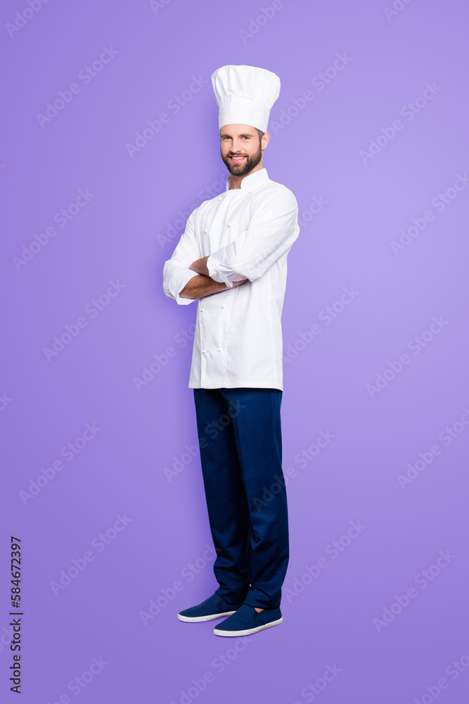 Full size body portrait of joyful positive chef cook with stubble in beret, having his arms crossed, isolated over grey background, looking at camera Full size body portrait of joyful positive chef cook with stubble in beret, having his arms crossed, isolated over grey background, looking at camera