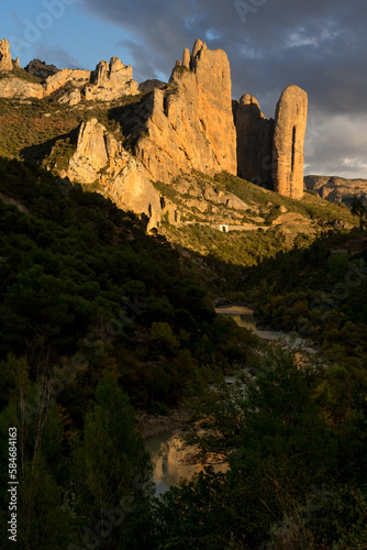 Famous climb walls mountains of Mallos de Riglos (Riglos cliffs) in Huesca at sunset.