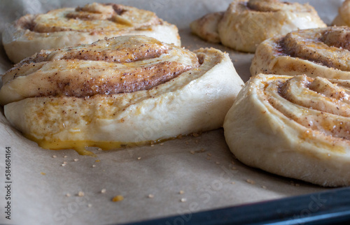 uncooked cinnamon buns decorated with granulated sugar