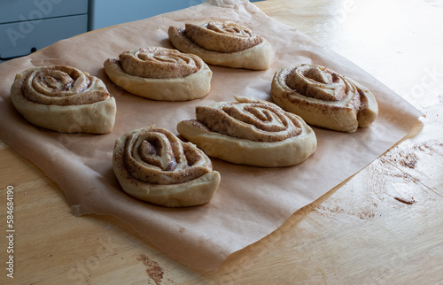 uncooked cinnamon buns decorated with granulated sugar