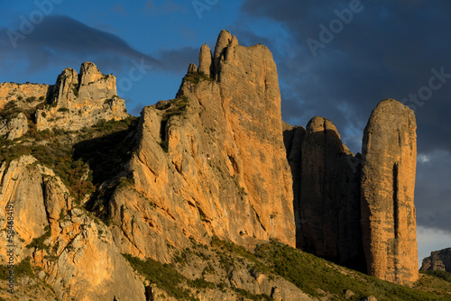 Famous climb walls mountains of Mallos de Riglos (Riglos cliffs) in Huesca at sunset.