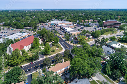 Aerial view of a business district with stores, a church and shopping center in downtown Northbrook, IL. photo