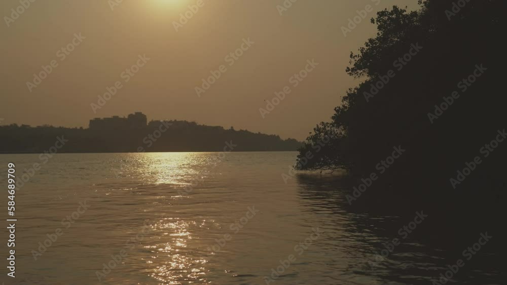 A beautiful sunrise over Rajbagh Beach in Canacona, South Goa, India, with stunning ocean views and serene water reflections. A beautiful sunrise over Rajbagh Beach in Canacona, South Goa, India, with stunning ocean views and serene water reflections.