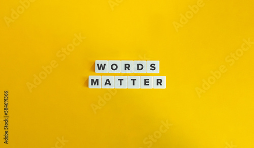 Words Matter Banner. Message on Block Letter Tiles on Yellow Background. Minimal Aesthetics. photo