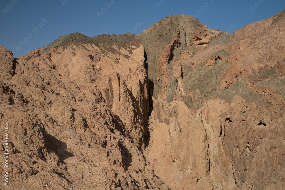 Sinai mountains at daytime, blue sky, top view of the mountains, colorful canyon at sunset in Egypt sunny day, landscape